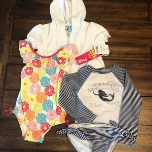 2 swimsuits and a coverup
